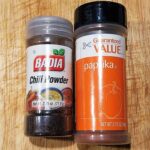 spice containers with Mexican chili powder and paprika